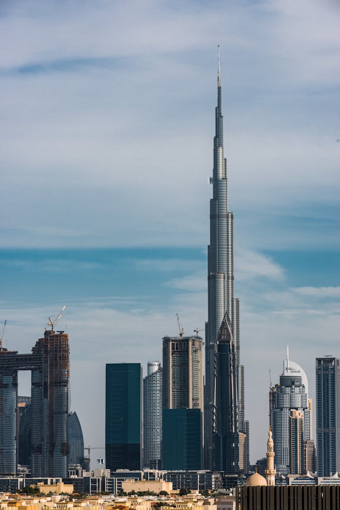 Dramatic view of Dubai's skyline with the iconic Burj Khalifa towering above.