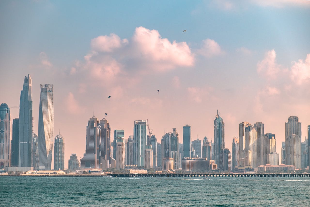 Breathtaking view of Dubai's modern skyline against a cloudy sky, showcasing its iconic architecture.